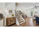 Welcoming entryway featuring hardwood floors, stairs, and modern decor with natural light at 565 Rose Garden Ln, Alpharetta, GA 30009