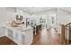 A bright gourmet kitchen with marble countertops, stainless steel appliances, and hardwood floors at 565 Rose Garden Ln, Alpharetta, GA 30009