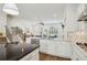 Open-concept kitchen with marble countertops, stainless steel appliances, and hardwood floors at 565 Rose Garden Ln, Alpharetta, GA 30009