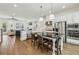 Gourmet kitchen with granite countertops, stainless steel appliances, and a center island with seating at 565 Rose Garden Ln, Alpharetta, GA 30009