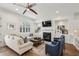 Comfortable living room features a fireplace, built-in shelving, and a neutral color palette at 565 Rose Garden Ln, Alpharetta, GA 30009