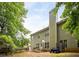 Back exterior with a deck, play set, green trees, and green siding at 1110 Cureton Dr, Austell, GA 30106