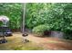 Backyard with patio, portable basketball hoop, and playground at 1110 Cureton Dr, Austell, GA 30106
