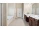 Bathroom with double sink vanity, and soaking tub at 1110 Cureton Dr, Austell, GA 30106
