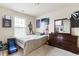 Cozy bedroom featuring a bed, dresser, and posters for a fun and personalized space at 1110 Cureton Dr, Austell, GA 30106