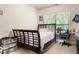 Bright bedroom with a bed, desk, and large window, perfect for relaxation and study at 1110 Cureton Dr, Austell, GA 30106