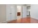 Neutral bedroom with wood floor, closet and en suite bathroom at 1110 Cureton Dr, Austell, GA 30106