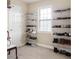 Closet with installed shoe racks, carpet and natural light at 1110 Cureton Dr, Austell, GA 30106