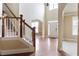Open foyer with hardwood floors, natural light, with stairs to a second floor at 1110 Cureton Dr, Austell, GA 30106