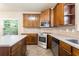 Well-equipped kitchen featuring stainless steel appliances, wooden cabinets, and ample counter space at 1110 Cureton Dr, Austell, GA 30106