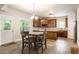 Cozy kitchen with an eat-in area, wooden cabinets, and an adjacent door to the outside at 1110 Cureton Dr, Austell, GA 30106