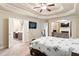 Spacious main bedroom with a decorative tray ceiling and en-suite bathroom access at 1110 Cureton Dr, Austell, GA 30106