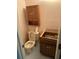 Bathroom with toilet and sink plus partially removed vanity cabinet and medicine cabinet at 1481 Yates Cv, Lawrenceville, GA 30043