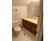 Bathroom with a toilet and a vanity plus an accent wall at 1481 Yates Cv, Lawrenceville, GA 30043