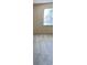 Bedroom featuring a large window for natural light and light colored carpeting at 1481 Yates Cv, Lawrenceville, GA 30043