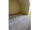 Spacious bedroom featuring carpet flooring and a window for natural light at 1481 Yates Cv, Lawrenceville, GA 30043