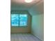 Bedroom with angled ceiling, a window providing natural light, and carpet at 1481 Yates Cv, Lawrenceville, GA 30043