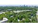 Aerial view captures the community amenities, including a pool and tennis court, nestled within a tree-filled area at 215 Summit North Ne Dr, Atlanta, GA 30324