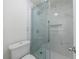 Modern bathroom featuring white-marbled shower and sliding glass doors at 215 Summit North Ne Dr, Atlanta, GA 30324