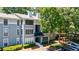 Well-maintained apartment complex featuring mature trees and private parking at 215 Summit North Ne Dr, Atlanta, GA 30324