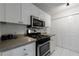 Efficiently designed kitchen with white cabinets, stainless steel appliances, and a gas range at 215 Summit North Ne Dr, Atlanta, GA 30324