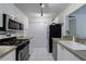 Updated kitchen with stainless steel appliances, white cabinets, and plenty of storage space at 215 Summit North Ne Dr, Atlanta, GA 30324