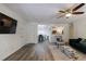 Open concept living space with hardwood floors connecting to the dining area and kitchen at 215 Summit North Ne Dr, Atlanta, GA 30324