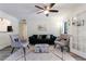 Bright living room with a ceiling fan and elegant French doors and hardwood floors at 215 Summit North Ne Dr, Atlanta, GA 30324