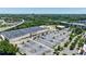 Aerial view of a commercial building with a large parking lot, surrounded by lush trees and major highways at 215 Summit North Ne Dr, Atlanta, GA 30324