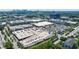 Aerial view of a vibrant shopping center with ample parking, retail stores, and residential buildings nearby at 215 Summit North Ne Dr, Atlanta, GA 30324