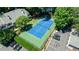 Aerial view of the community's tennis court with parking and benches, surrounded by lush greenery and residential buildings at 215 Summit North Ne Dr, Atlanta, GA 30324