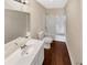 Bathroom featuring hardwood floors, and shower over tub at 690 Horsley Mill Rd, Carrollton, GA 30116