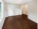 Cozy room featuring hardwood floors, walk-in closet, and a neutral color scheme at 690 Horsley Mill Rd, Carrollton, GA 30116