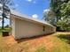 Exterior side view of the property showcasing siding, metal roof, and outdoor AC unit at 690 Horsley Mill Rd, Carrollton, GA 30116