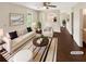 Bright, staged living room featuring hardwood floors, neutral colors, and lots of natural light at 690 Horsley Mill Rd, Carrollton, GA 30116
