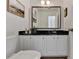 Bathroom features vanity with granite countertop, decorative mirror, and toilet at 882 Cedar Canyon Se Sq, Marietta, GA 30067