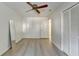 Spacious bedroom featuring wood-look floors, ceiling fan, and ample closet space at 882 Cedar Canyon Se Sq, Marietta, GA 30067