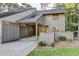Inviting exterior of home with attached carport, landscaping, and neutral toned siding at 882 Cedar Canyon Se Sq, Marietta, GA 30067