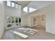 Sunlit living room with high ceilings, modern lighting, and an open layout at 882 Cedar Canyon Se Sq, Marietta, GA 30067