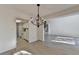 Open floor plan showcasing light-filled living room and kitchen with modern chandelier at 882 Cedar Canyon Se Sq, Marietta, GA 30067