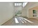 Light-filled living room with soaring ceilings and large windows at 882 Cedar Canyon Se Sq, Marietta, GA 30067