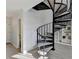 Unique spiral staircase leading to upper level with open landing and built in bookcases at 882 Cedar Canyon Se Sq, Marietta, GA 30067