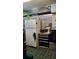 A basement featuring a white refrigerator and stove with an adjacent black storage unit and diamond plate sheathing at 1026 Riverbend Club Se Dr, Atlanta, GA 30339