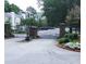 Elegant gated community entrance with brick columns and well-maintained landscaping offering security and prestige at 1026 Riverbend Club Se Dr, Atlanta, GA 30339