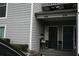 Charming townhouse exterior featuring dual entrances and neutral gray siding with white trim at 1026 Riverbend Club Se Dr, Atlanta, GA 30339