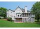 Spacious home featuring a deck, screened porch, patio, and backyard at 1409 Echo Mill Dr, Powder Springs, GA 30127