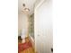 Bathroom with a shower over a tub with a glass door and a white 5-panel door at 1409 Echo Mill Dr, Powder Springs, GA 30127