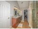 This primary bathroom boasts a double sink, granite counters, and a glass shower at 1409 Echo Mill Dr, Powder Springs, GA 30127