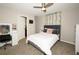 Cozy bedroom with decor, including a ceiling fan, ivy, and vanity area at 1409 Echo Mill Dr, Powder Springs, GA 30127