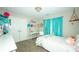 Bright bedroom with white furniture, decor, and a window with aqua curtains at 1409 Echo Mill Dr, Powder Springs, GA 30127